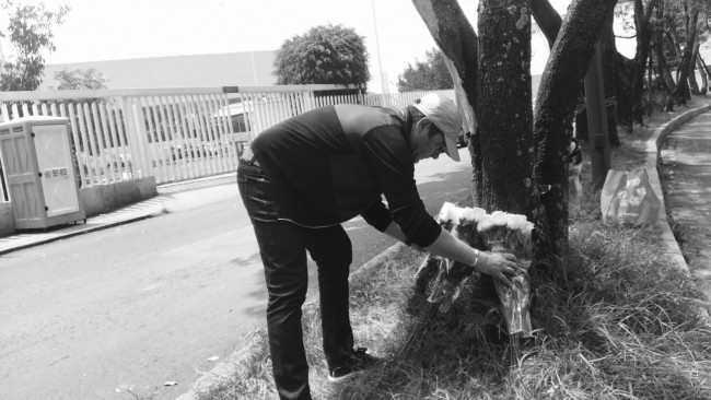 Greg laying flowers