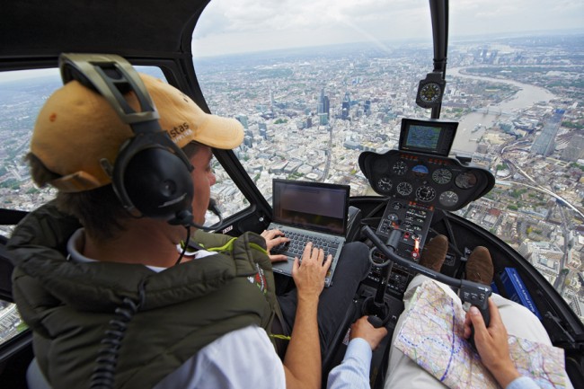 Internationally renowned ForEx trader and CEO of Knowledge to Action, Greg Secker, will make money from thin air on Friday as he hovers above the City as the Flying Trader. 
A trained helicopter pilot, Greg will be flying his chopper 10,000ft above London while trading live on the foreign exchange markets. Anyone can join in as Greg sends his trades down to the City beneath him, with all brokerage commissions going to child-based charities Barnardo’s and The Ubuntu Education Fund, on June 24, 2011 in London, United Kingdom.

For more information about using this image contact Micha Theiner:
T: +44 (0) 7525 627 491
E: micha@michatheiner.com
http:///www.michatheiner.com